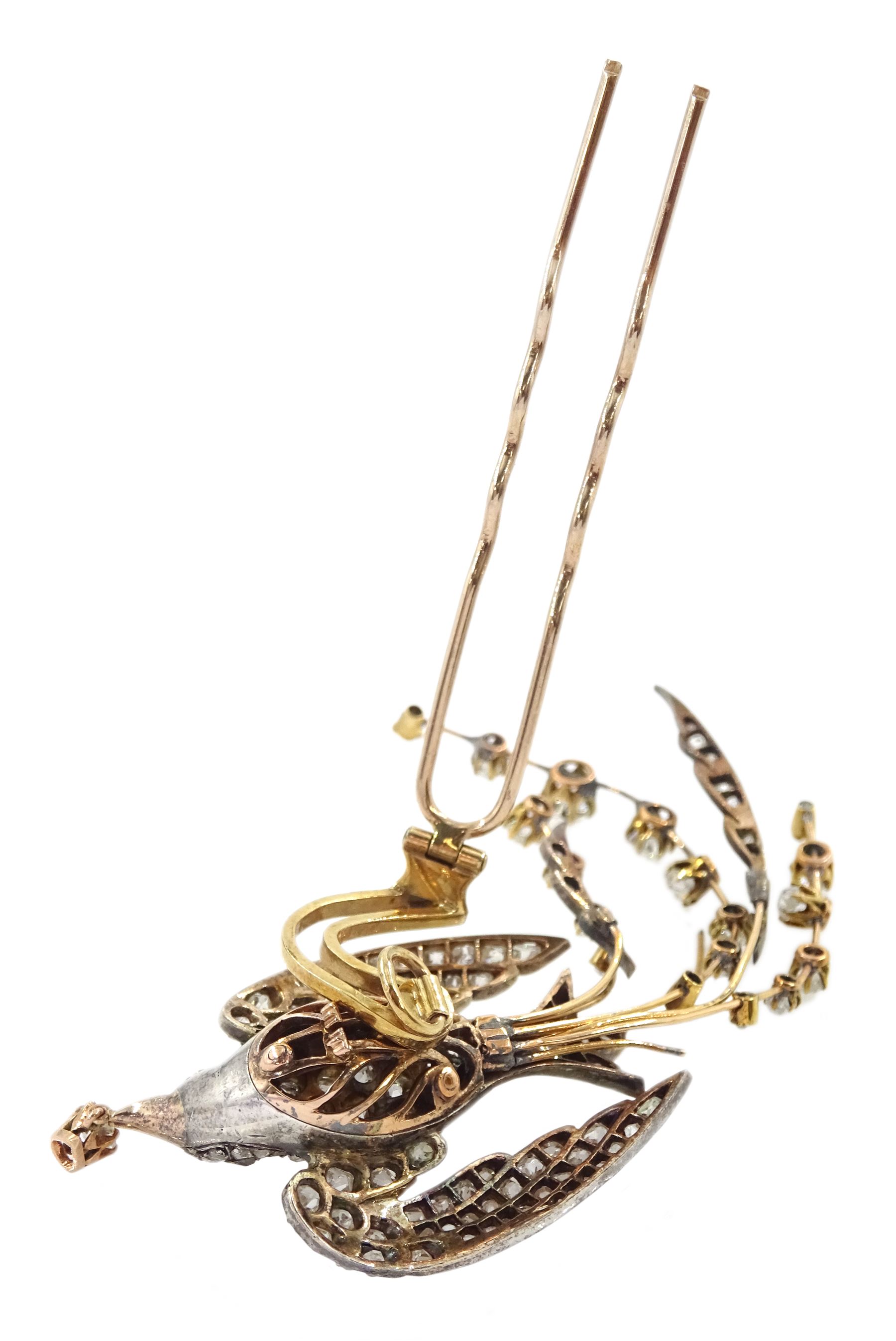 Victorian diamond swallow aigrette brooch, the gold backed silver swallow in flight set with old cut and rose cut diamonds, with cabochon ruby eyes, holding a pear cut diamond of approx 0.25 carat, to an old cut diamond spray tail of approx 1.95 carat, total diamond weight approx 4.00 carat