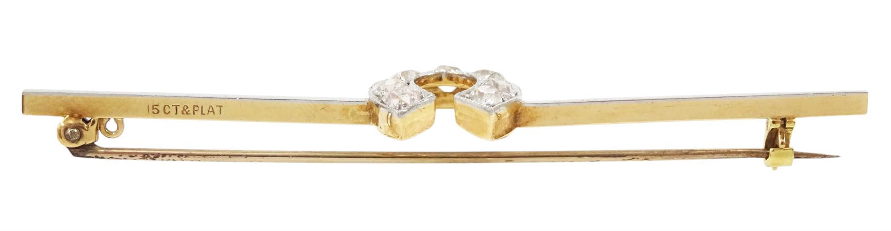 Early 20th century gold old cut diamond horseshoe brooch, stamped 15ct Plat, total diamond weight approx 1.05 carat, in velvet and ilk lined box