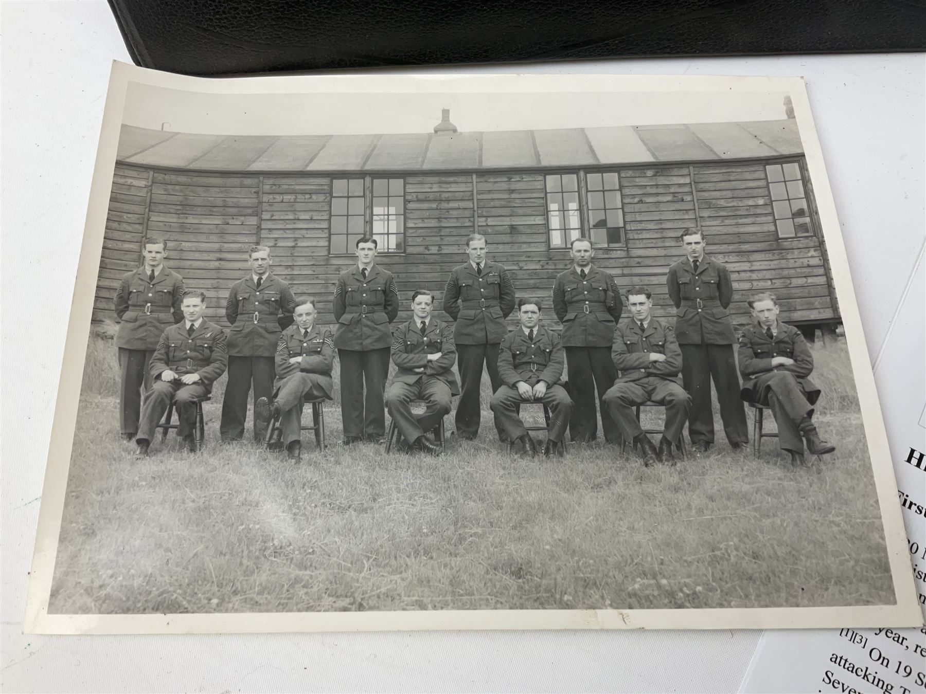 144 Squadron RAF - album containing over one hundred photographs and postcards of varying sizes including group shots, aircraft on the ground and in the air, German aircraft, crashes etc; sizes from 3.5 x 6cm to 16 x 21cm; and quantity of modern reference material
