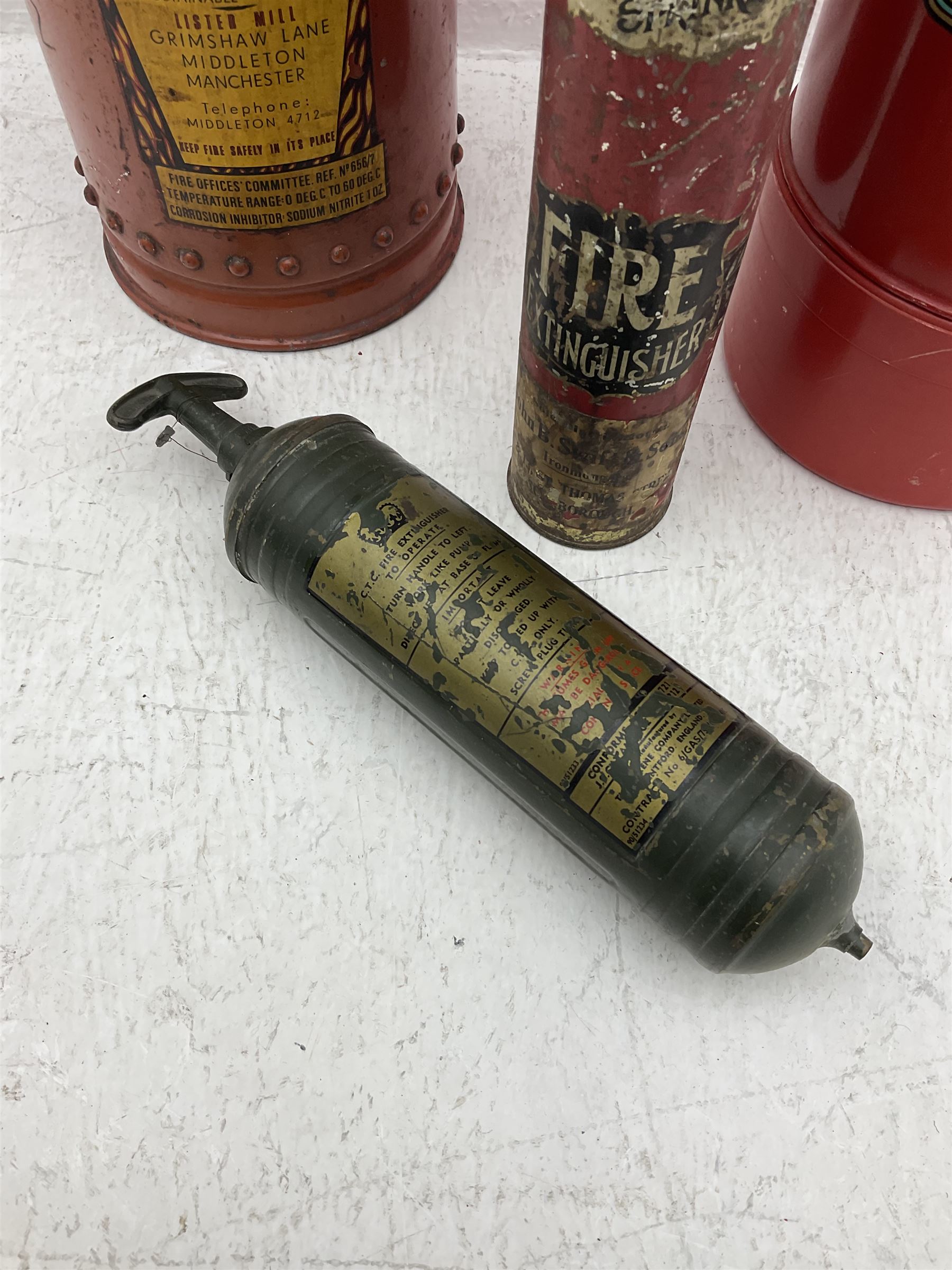Early 20th century Kyl Fyre dry powder fire extinguisher, together with a Pyrene C.T.C fire extinguisher, and two larger fire extinguishers comprising a 1962 Minimax example and a Lister example, tallest H66cm