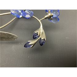 Eleven Swarovski Crystal flowers, to include violet, sunflower, delphinium, forget-me-not and lily-of-the-valley, each on stylised metal stems, tallest H23cm