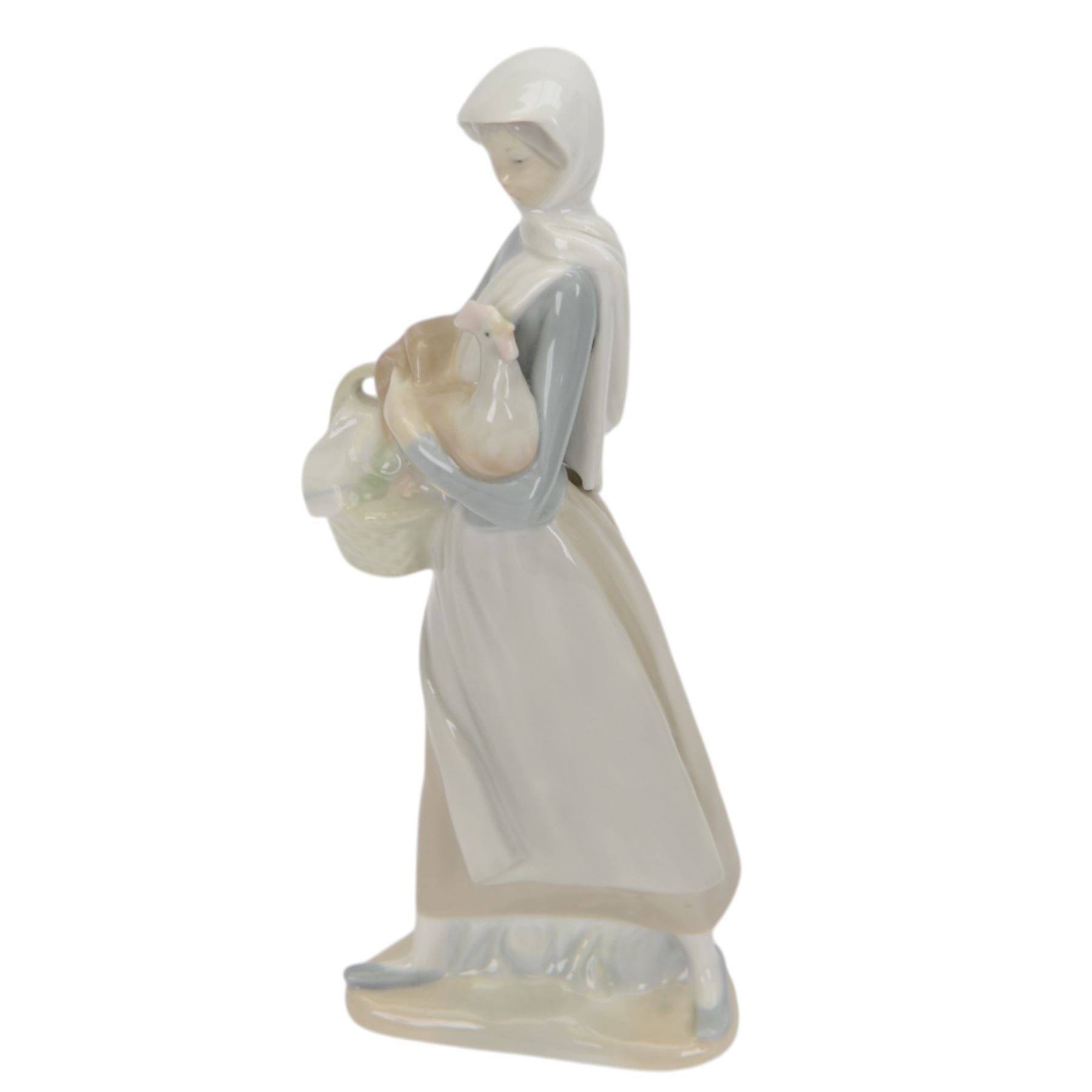 Four Lladro figures, comprising Loving Care no 6087, Young Nurse no 6307, Girl with Chicken no 4592 and Female Physician no 5197, three with original boxes 