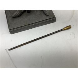 Cast iron fire companion set modelled as a knight in armour with fleur-de-lis shield and sword concealing fire poker, with brass tongs to reverse, raised upon stepped rectangular base, H55cm