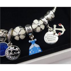 Pandora Moments flower clasp silver bracelet with Disney Cinderella charm, seven other Pandora charms, and flower safety chain, boxed