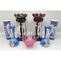 Pair of Victorian ruby glass lustre vases, each with hollow baluster stem, and domed base, hung with prism drops and lozenges, together with two hand decorated glass jugs, cranberry glass bowl and a pair of Jones & Sons vases, luster H32.5cm