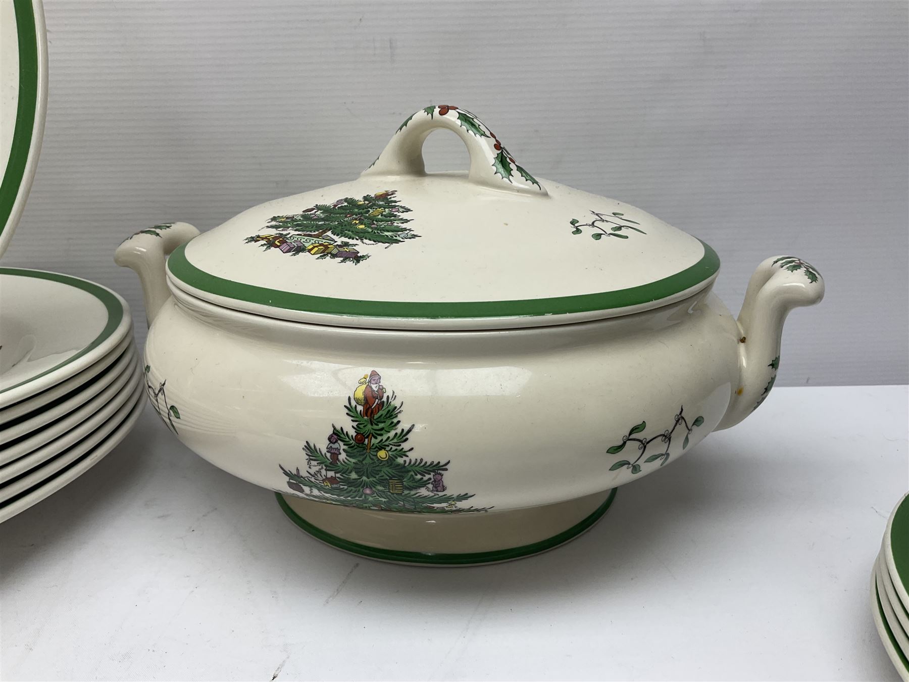 Collection of Spode Christmas Tree pattern part dinner service, comprising three covered tureens, eight dinner plates, eight side plates, eight dessert plates, sauce boat and saucer and serving platter (30)