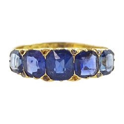 Victorian 18ct gold graduating five stone, cushion cut sapphire ring, with diamond accents...
