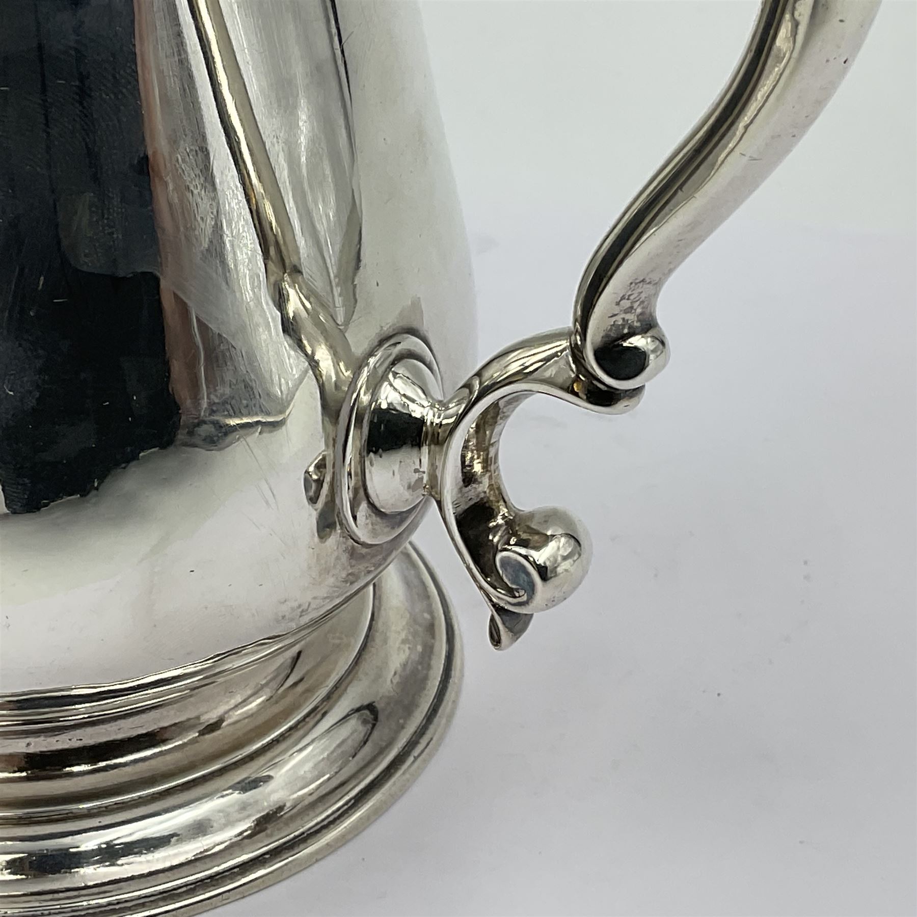 George II silver tankard, of waisted baluster form with acanthus capped C scroll handle, the body engraved with a lion rampant, upon a circular spreading foot, hallmarked Gabriel Sleath & Francis Crump, London 1754, H13cm