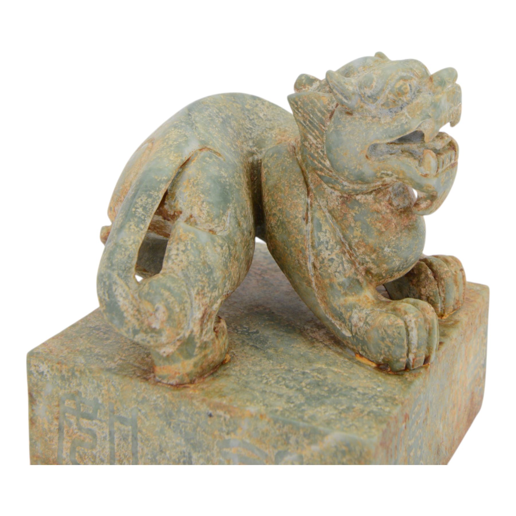 Large 20th century Chinese patinated hardstone dragon seal, the square seal with incised characters to sides and underside, surmounted by the figure of a dragon, H15cm W13cm D13cm