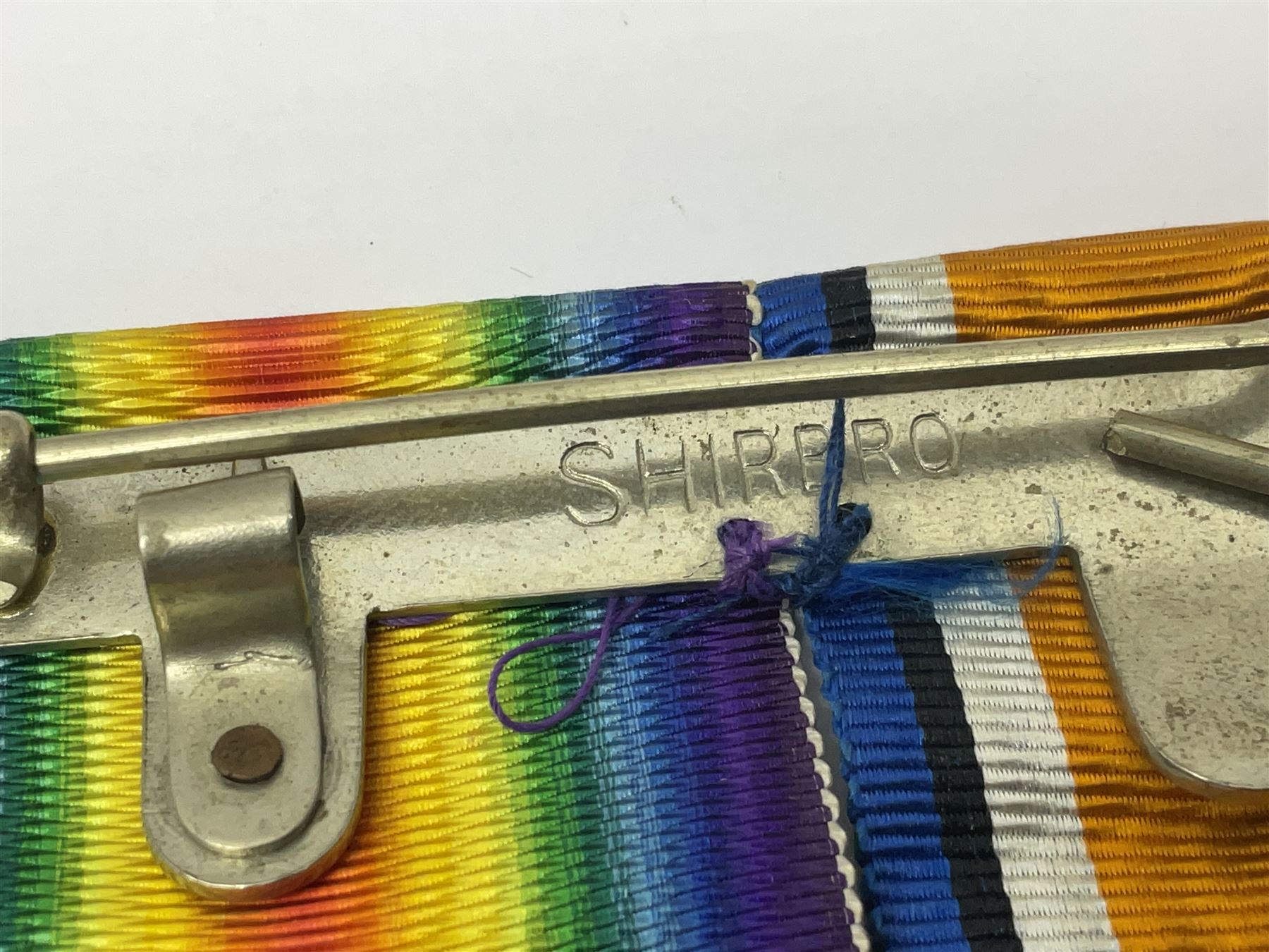 WWI pair of medals comprising British War Medal and Victory Medal awarded to G/62196 Pte. H. Ferguson R. Fus. with ribbons on wearing bar; together with bronze memorial plaque to Henry Ferguson (3)