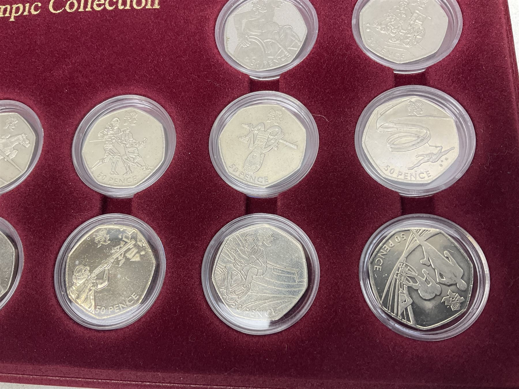Queen Elizabeth II United Kingdom London 2012 Olympic commemorative fifty pence collection comprising twenty-nine coins, housed in unofficial display case