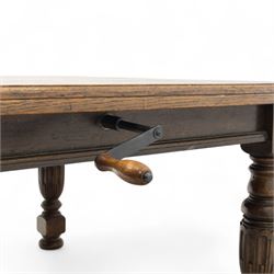 Victorian oak extending dining table, rectangular moulded top with figured grain pattern and wind-out action operated by removable crank handle, complete with additional leaves, raised on four boldly turned and reeded baluster supports terminating in squat bun feet (Extends to 238cm)