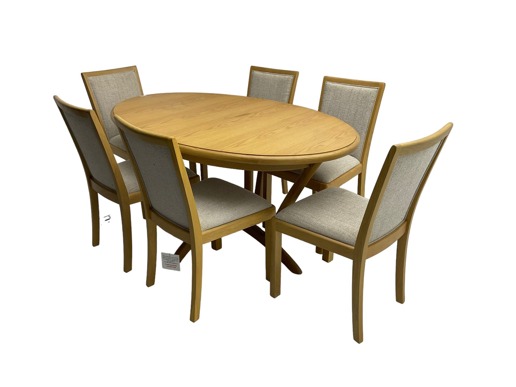 Contemporary light oak oval extending dining table, shaped X-frame base (W160cm D102cm); and set of six light oak dining chairs, back and seat upholstered in textured pebble cream fabric (W50cm H90cm)