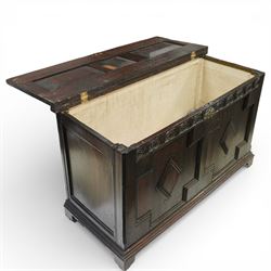 18th century oak coffer, the three panel hinged lid above a frieze carved with repeated lunettes, the front formed with geometric moulded panels centred by lozenge motifs, raised on bracket feet