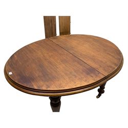 Victorian mahogany oval extending dining table, moulded edge and banded frieze, turned supports on ceramic castors with two additional leaves and winder