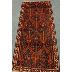  Persian runner rug, deep blue ground with red geometric pointed design, 251cm x 112cm  