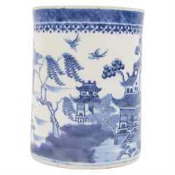 Large 18th century Chinese export blue and white tankard, of cylindrical form with foliate mounted strap handle, the body painted with a riverside landscape with pagodas, willows and pine trees, beneath a cell and spear head band to rim, H14cm D10.5cm