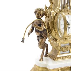 Italian- 20th century 8-day gilt figural mantle clock in the style of a 19th century Parisian lyre clock, drum movement with a porcelain dial flanked by playful cloven-hoofed cherubs on a white marble plinth, raised on a a decorative base with splayed paw feet, twin train spring driven Hermle movement with a floating balance escapement, sounding the hours and half hours on two bells. With key.    