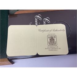 The Royal Mint 'Conservation Coin Collection' formed of twenty-four silver proof coins, housed in the wooden display case, with information booklet