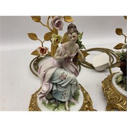 Pair of Capodimonte figural lamp bases, depicting a male and female upon a tree, both on a metal gilt stand with floral detail, H32.5cm