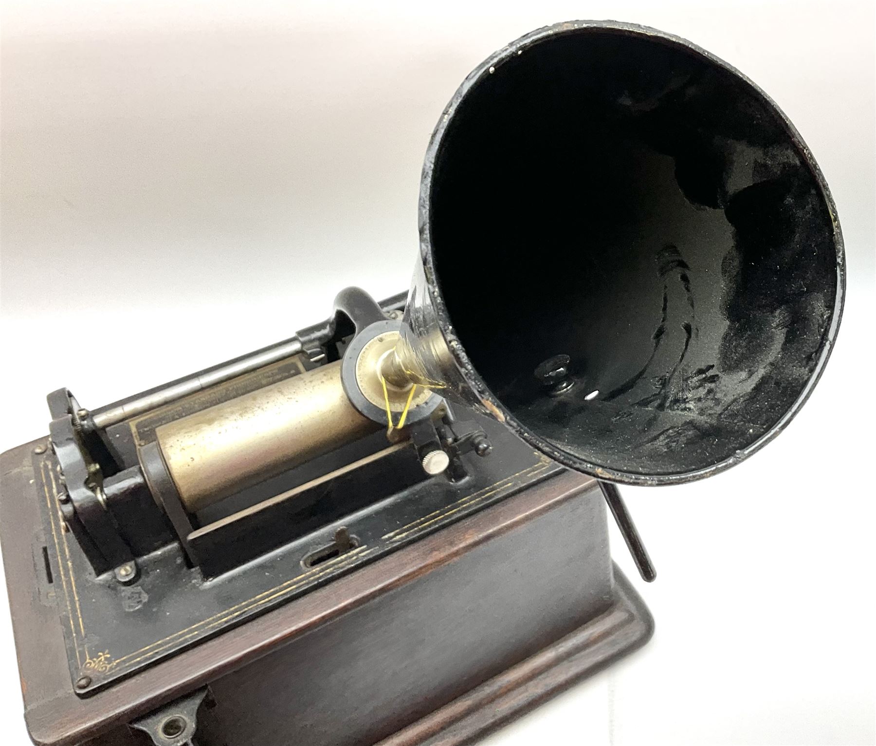 Edison Standard Phonograph with oak base (no cover), the reproducer marked 'Model C', serial no. 634857, last patent date Oct.1905, with black japanned conical horn L33cm; together with five cylinders