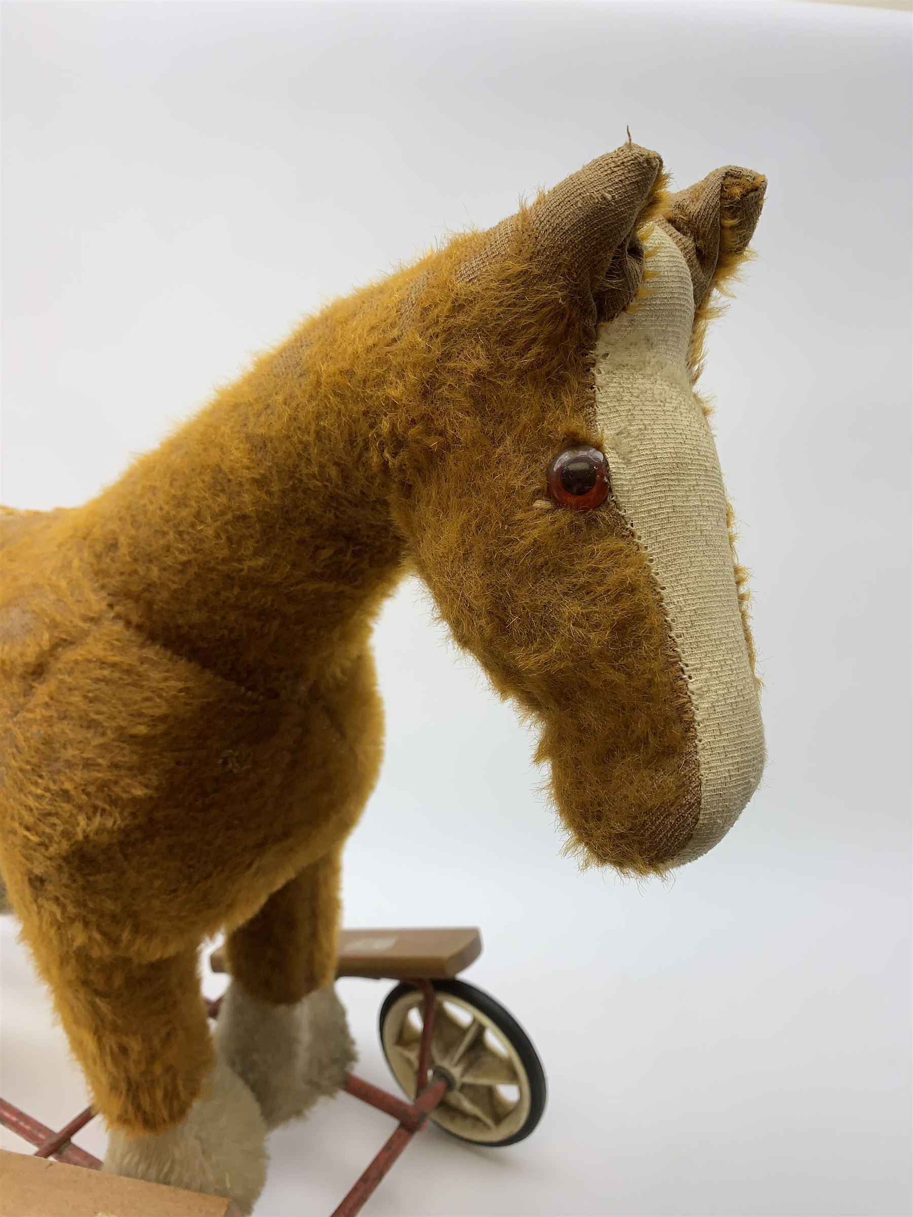 Pedigree push along plush covered horse 1950s-60s with red tubular metal framework and beech foot rests H25