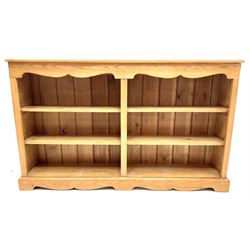 Solid pine low open bookcase, six shelves, platform base