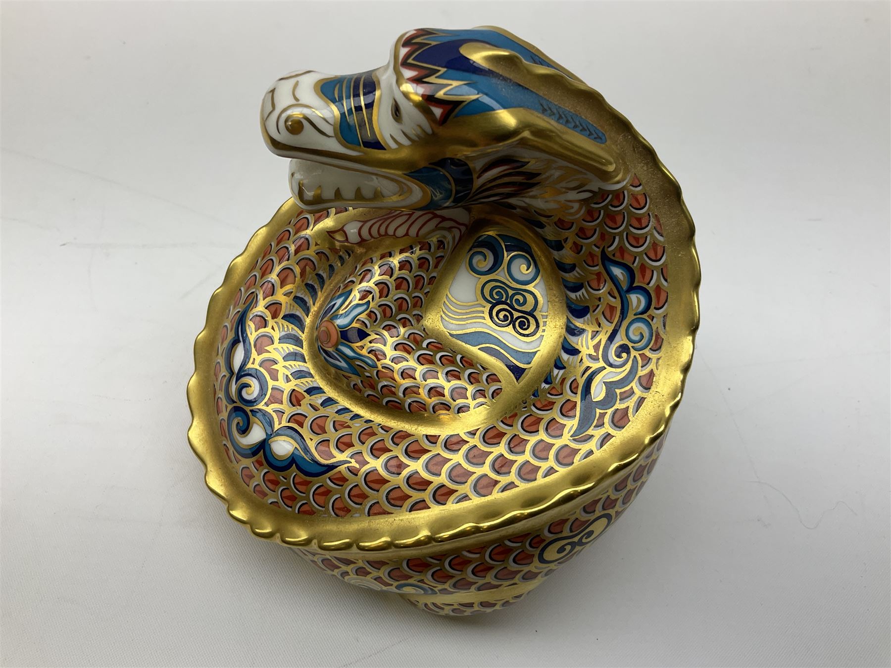 Two Royal Crown Derby paperweights, Dragon of Happiness, limited edition 1227/1500 and Dragon of Good Fortune, limited edition 1227/1500, both with gold stopper, hardwood base, certificate and with printed mark beneath