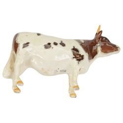 Six Beswick cattle figures, comprising Jersey family group; Bull Ch. Dunsley Coy Boy, model 1422, Cow Ch. Newton Tinkle, model 1345 and Calf, model 1249, Ayrshire family group; Bull Ch. Whitehill Mandate, model 1454, Cow Ch. Ickham Bessie, model 1350, and Calf, model 1249