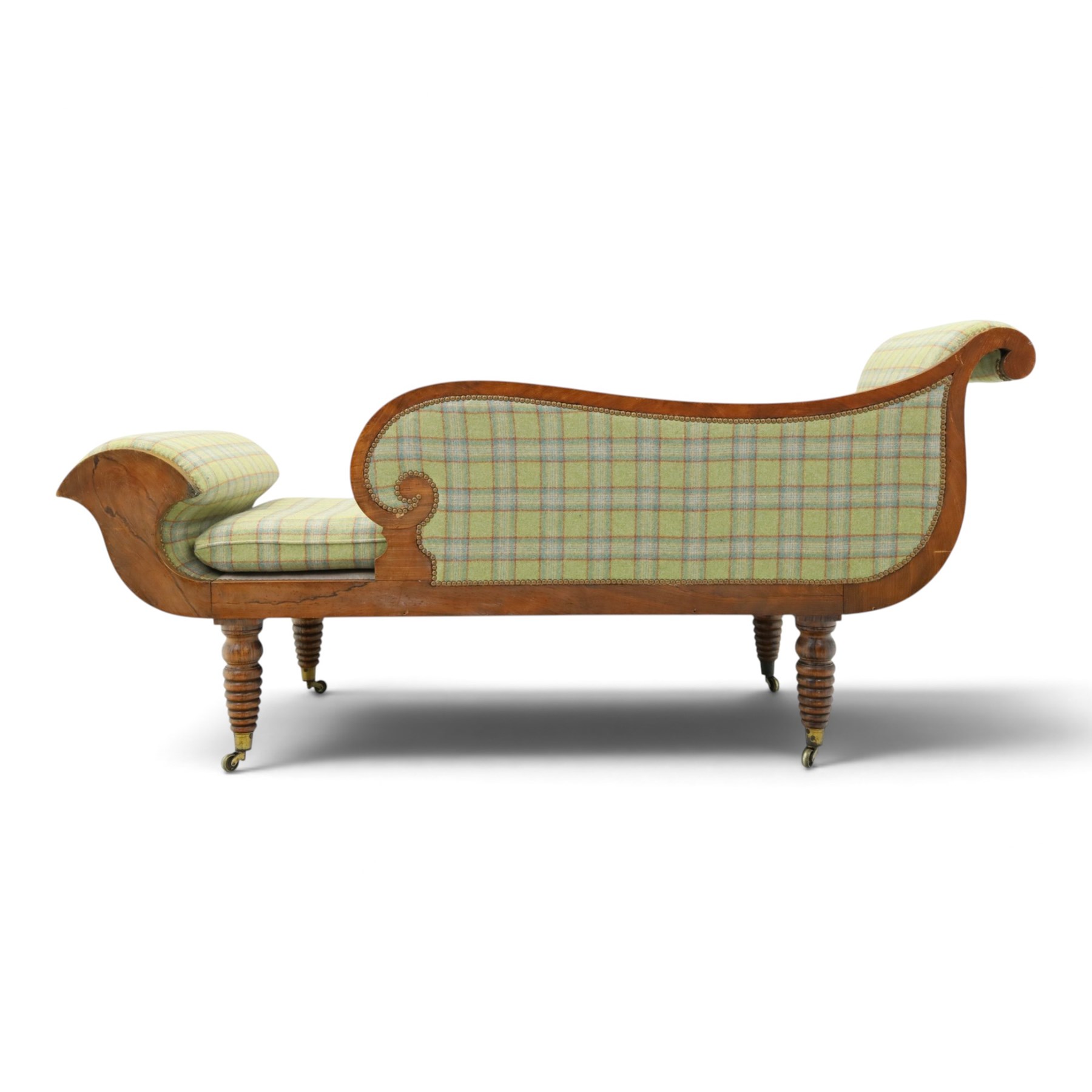  19th century scumbled oak chaise longue upholstered in tartan fabric, swept frame with gilt mounts, studded border with loose base cushion, raised on turned bobbin supports terminating brass castors