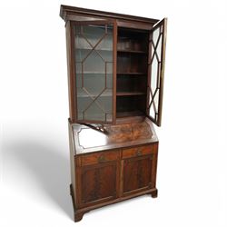 Maples & Co. Edwardian mahogany bureau bookcase, projecting moulded cornice over two astragal glazed door, panelled hinged lid over two drawers and double cupboard, on bracket feet