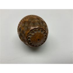 Three 19th century coquilla nut pomanders or flea catchers, each of egg shaped form with carved and pierced decoration and screw threaded join, largest example H7cm