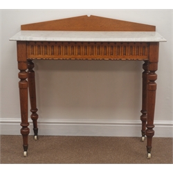  Late Victorian golden oak marble top washstand, shaped raised back, carved frieze, turned supports, W92cm, H87cm, D35cm  