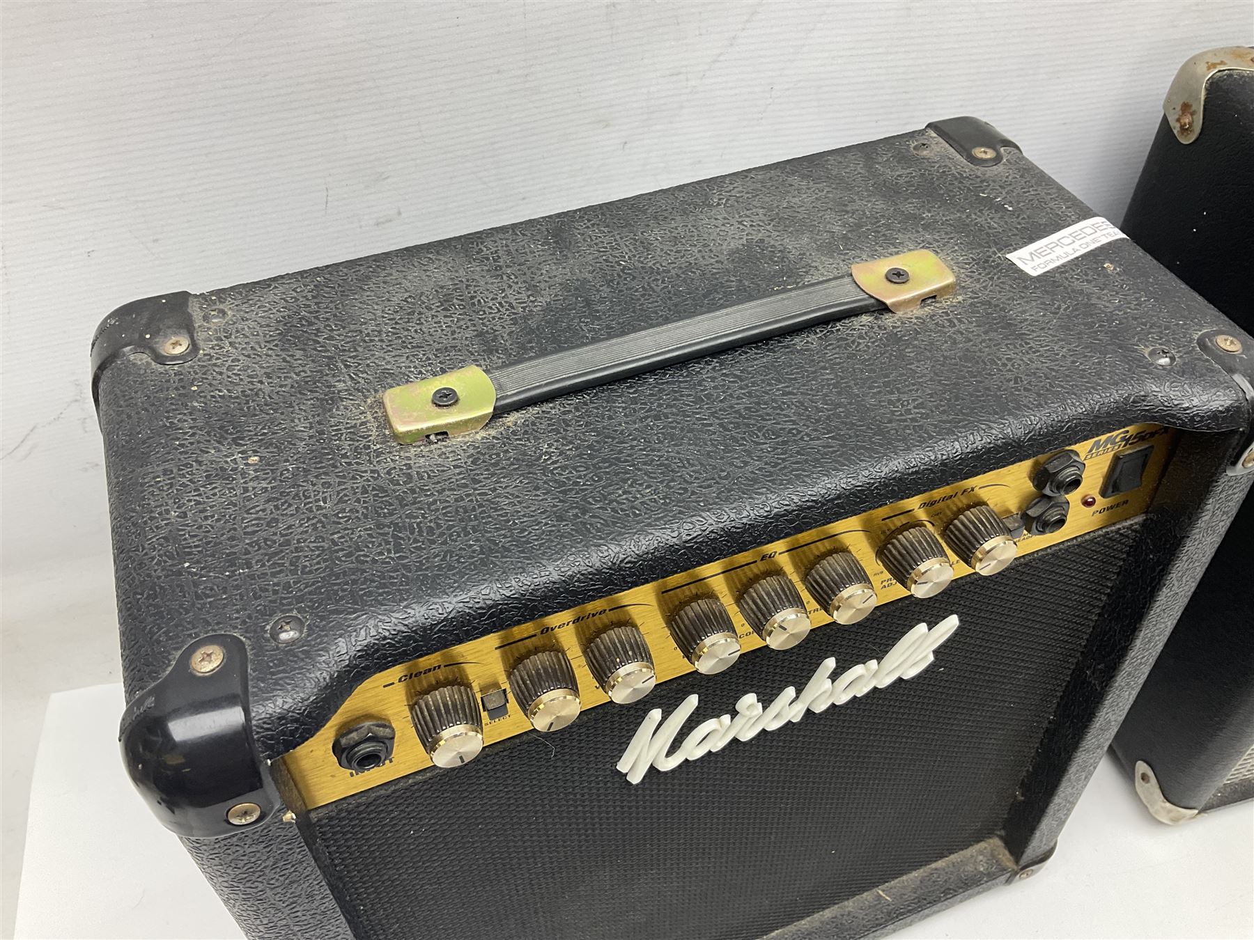 Aria Sinsonido mahogany electric travel guitar, serial no.0502385 L86cm; in original gig bag with earphones and GM11 Minituner; together with Fender Sidekick Reverb 25 amplifier and Marshall MG Series 15DFX amplifier (3)