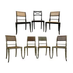 Collection of Regency dining chairs - set of four Regency painted beech dining chairs, with cane seat and back, on collar turned supports with splayed feet (W46cm, H84cm); a pair of Regency ebonised dining chairs (W47cm, H77cm); and a single Regency dining chair, the cresting rail painted with floral cornucopias and central putto vignette, X-frame back over cane seat, on collar turned front supports painted with foliage (W46cm, H84cm) (7)