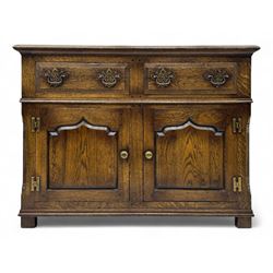 Early 20th century Jacobean design oak dresser sideboard, rectangular top with moulded edge over two baize-lined drawers with pierced handles, above two fielded panel cupboard doors, on stile supports