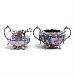 Early 20th century silver plated four piece melon-shaped tea service by James Dixon & Son Sheffield, comprising teapot, hot water jug, milk jug and open sucrier, together with a silver plated twin handled tray with engraved floral decoration