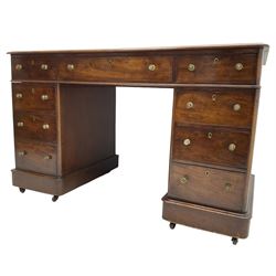 Victorian mahogany twin pedestal desk, rectangular top with inset ebonised leather writing surface, fitted with nine graduating drawers with brass pull handles, on plinth bases