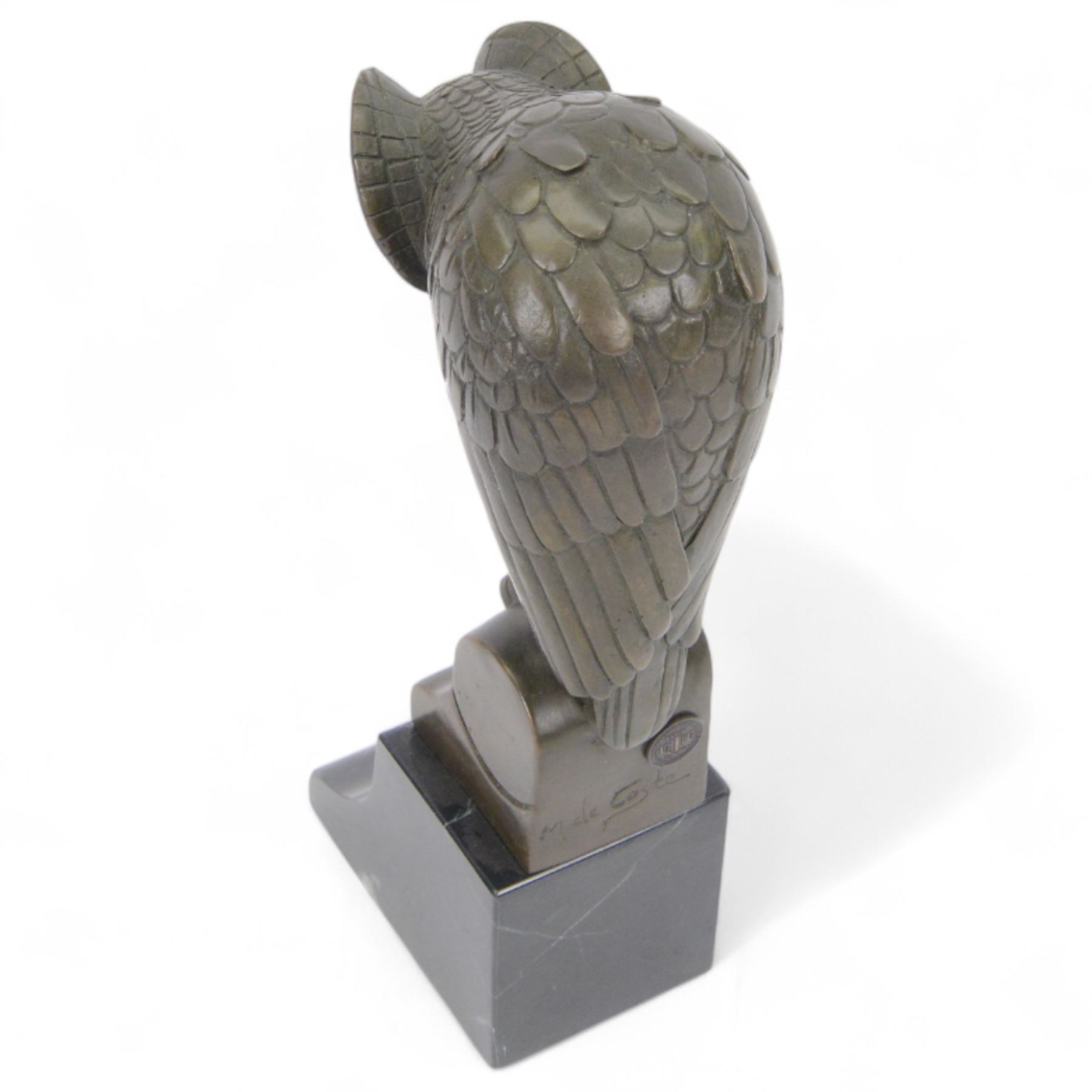 Bronze figure of a stylised eagle owl upon a marble base, H25cm 