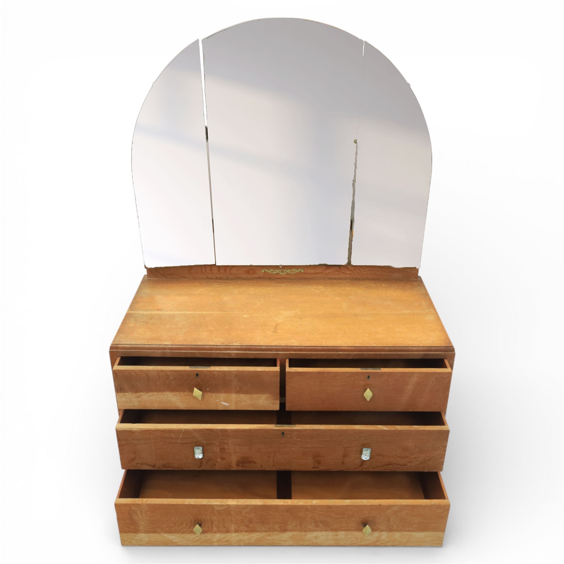 Early 20th century Art Deco bedroom suite, comprising double wardrobe, dressing table and chest of drawers, constructed in walnut with figured veneers and geometric banding, the wardrobe with arched top and panelled doors enclosing a fitted interior, the dressing table with rectangular top below a three panel mirror arrangement, fitted with two short over two long drawers, the chest with three short and three long drawers, each piece fitted with faceted handles and raised on shaped feet
Wardrobe (H 177cm, D 46cm, W 112cm)
Chest (H 85cm, D 48cm, W 92cm)
Dressing table (H 160cm, D 52cm, W 106cm)
