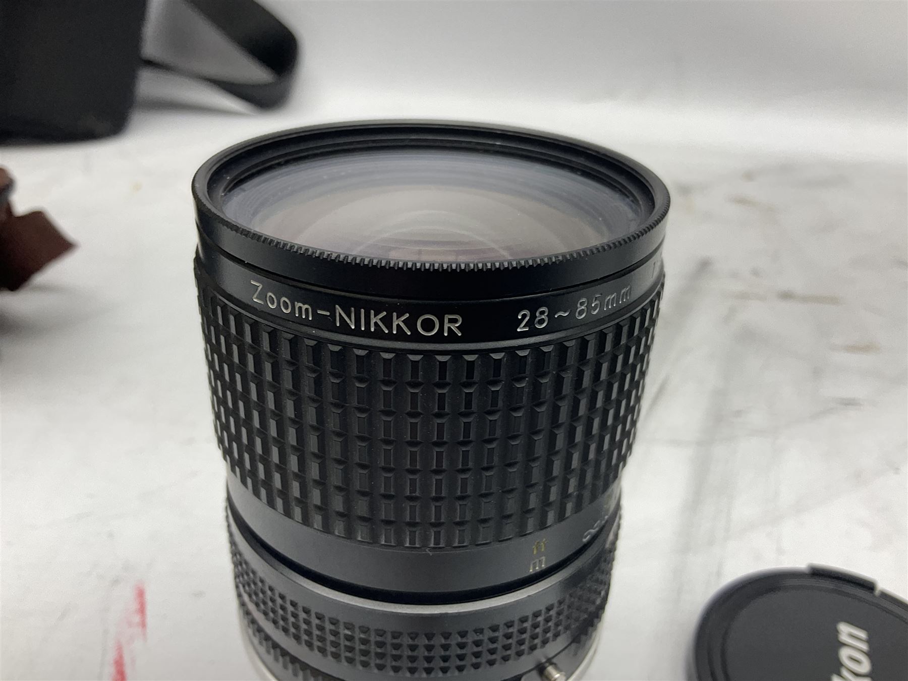 Nikon F3 SLR camera, serial number 1583609; Nikon 50mm 1:1.8 lens; Nikon 28-85mm 1:3.5-4.5 zoom lens; Vivitar MC 2X-3 Tele Converter, and a Nikon Speedlight SB-16 flash