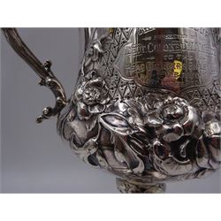 Victorian silver trophy cup, decorated in high relief with flower heads and scrolls, engraved to body 'Challenge Cup presented by Lieut Colonel W.A.White to the Head Quarters Rifle Club 1st V.B.P.W.O West Yorks Reg 1901' with twin acanthus capped scroll handles, upon knopped stem and lobed circular foot embossed with flower heads, hallmarked 	Robert Harper, London 1862, including handles H26.5cm