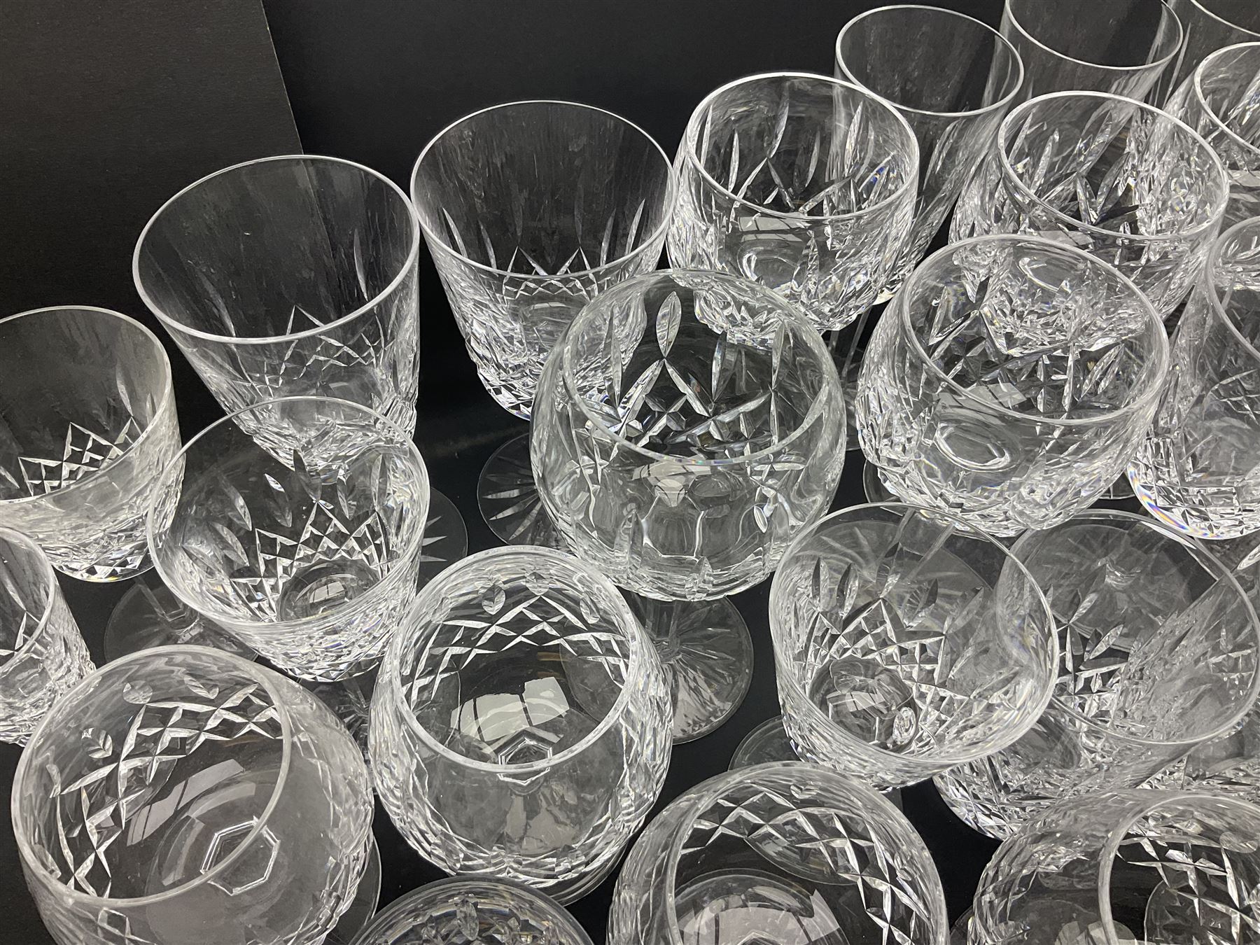 Set of Waterford Crystal Lismore pattern drinking glasses for six people, including hock glasses, goblets, champagne flutes,  sherry glasses, liqueur glasses, hi ball glasses, whisky glasses, brandy balloons, etc, all with etched maker's mark beneath  (62)