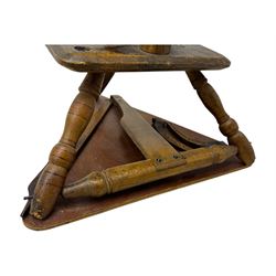 Late 19th century turned beech spinning wheel, upright form with single treadle, triangular base, and a flyer and bobbin assembly surmounted by a turned finial.