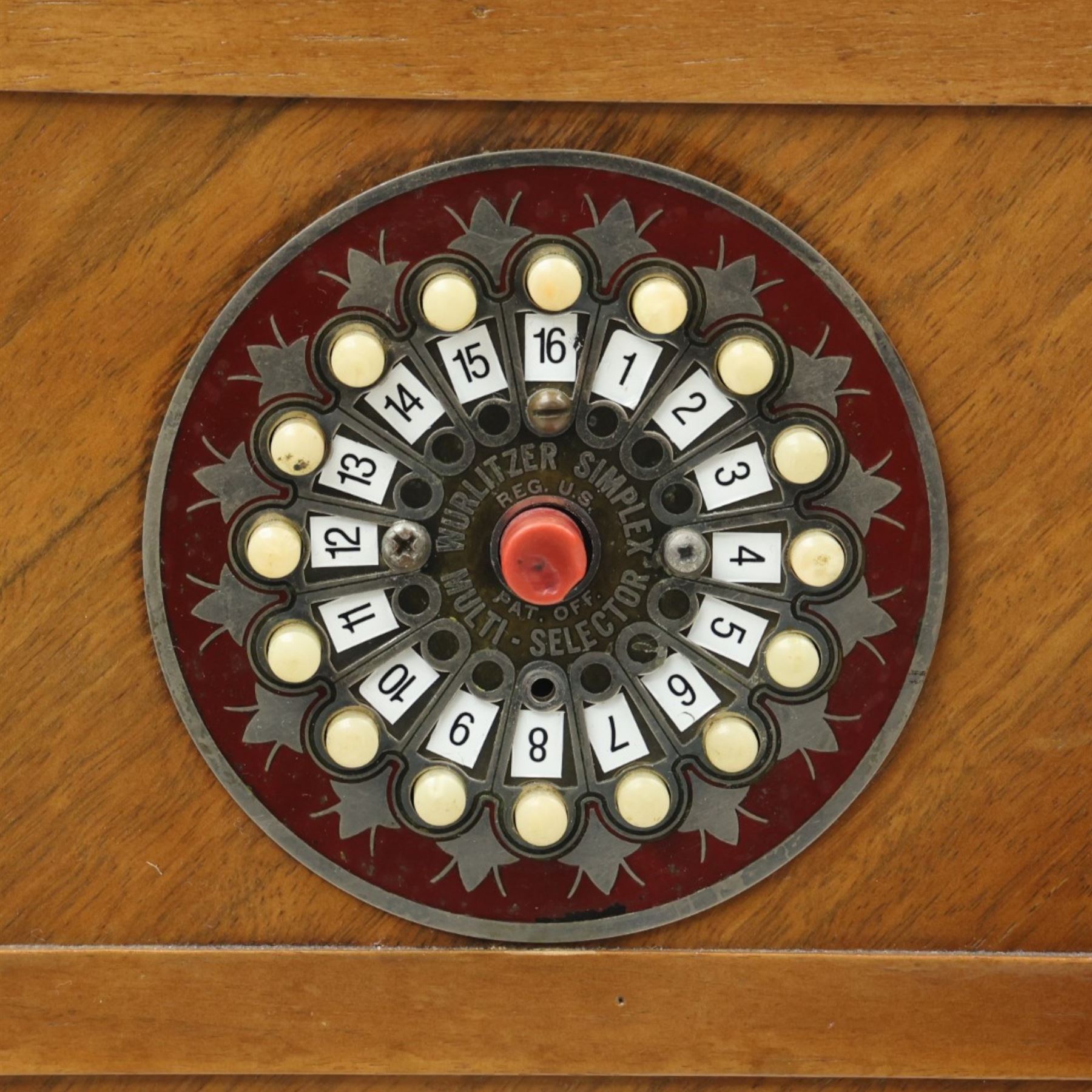 Rudolf Wurlitzer Company - Model 616 'Simplex' 1937 jukebox, figured walnut veneered cabinet with illuminated red and amber side panels enclosed by chromed uprights, glazed upper record compartment, cast Art Deco speaker grille, coin-operated push-button selection panel with circular title index, raised on a moulded base