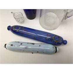 Two Victorian glass rolling pins, the larger blue example inscribed 'Remember Me' between floral sprays, largest L33.5cm, together with a late Victorian clear glass jug, H24cm, Bristol Blue type tumbler, and small moulded cream jug. 