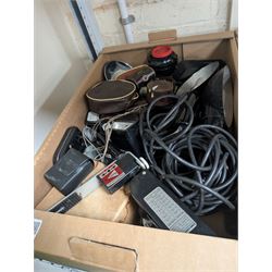 Collection of camera flashes and light meters, including Weston Master light meters, Braun Hobby flash, Hanimex XP1, in two boxes