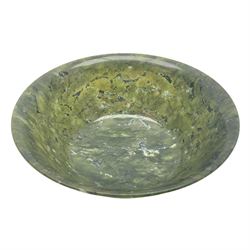 Chinese carved spinach jade bowl, with deep rounded sides rising to a flaring rim from a short circular foot, D21cm
