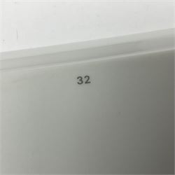 Limoges for Cartier, ceramic trinket dish, of rectangular form with rounded corners, decorated to centre with leopard upon a blue ball, with blue and gilt rim, with printed mark beneath, in original box, H15.5cm, W21cm