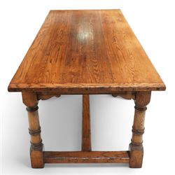 Late 20th century oak refectory table in 17th century style, with plank top and end leaf, raised on ring turned baluster legs with square feet, joined by conforming stretchers (260 cm extended)